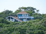 The upper two levels of this Roatan house include the master suite with king bed, den/sitting room and the `Turret bedroom.